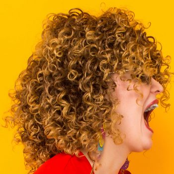 Half-faced portrait of serious concentrated confident brutal chic handsome attractive classy modern guy wearing classic white shirt suspenders isolated on gray background copyspace empty blank